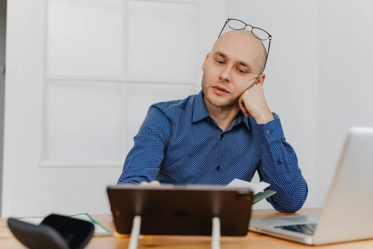 A Man Resting his Head on Hand